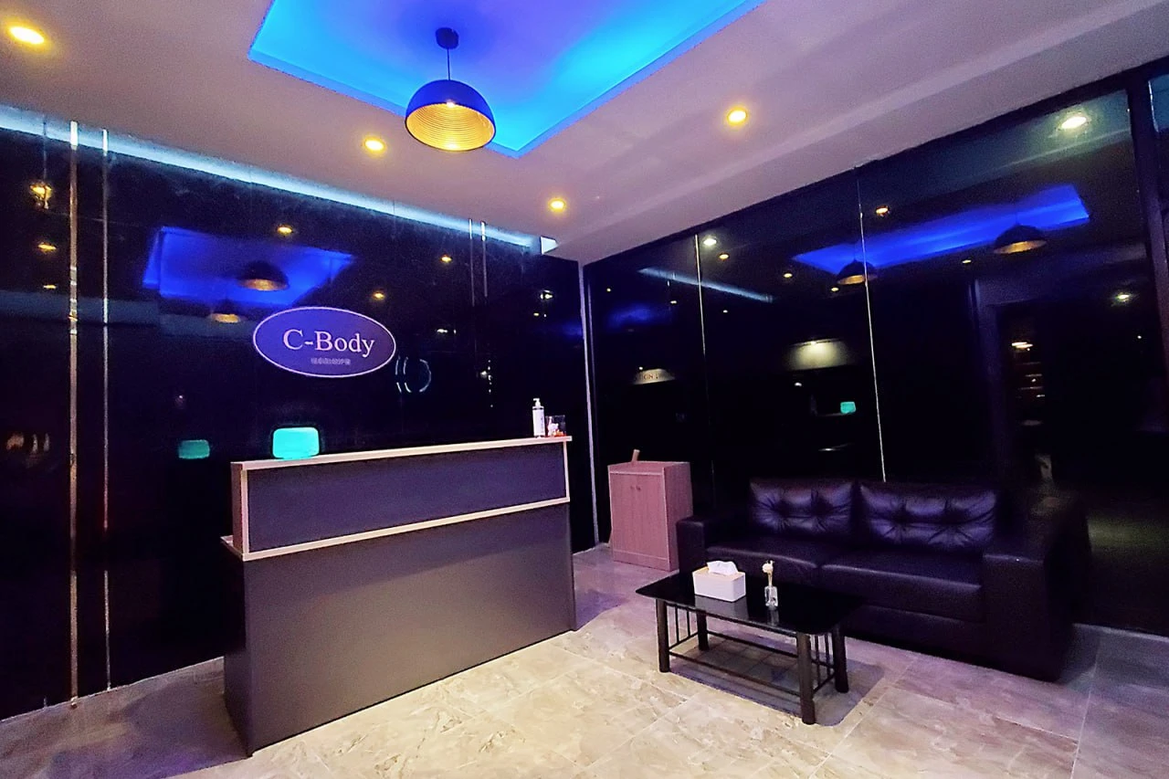 Luxury massage room at C-Body Spa Club Bangkok - Private erotic massage suite with elegant dark interior design